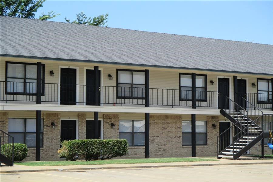a building with a balcony and a staircase
