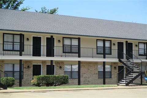 a building with a balcony and a staircase