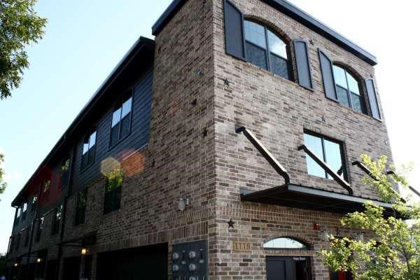 a brick building with windows and a