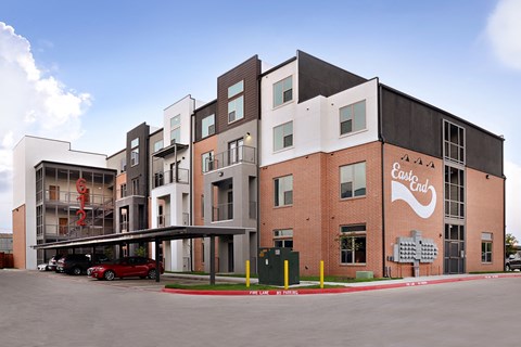 a building with a red car parked in front of it