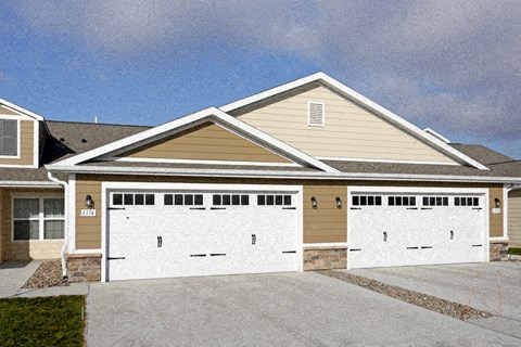 A two-car garage is attached to a house.
