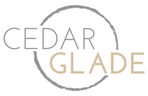 a logo for cedar glade with a cross