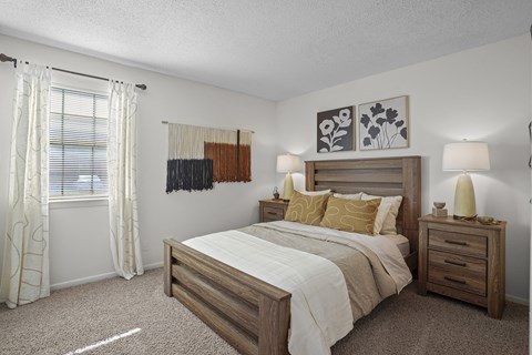 our spacious bedroom features a king sized bed and a window