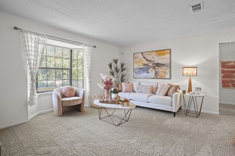 a living room with a couch and a table