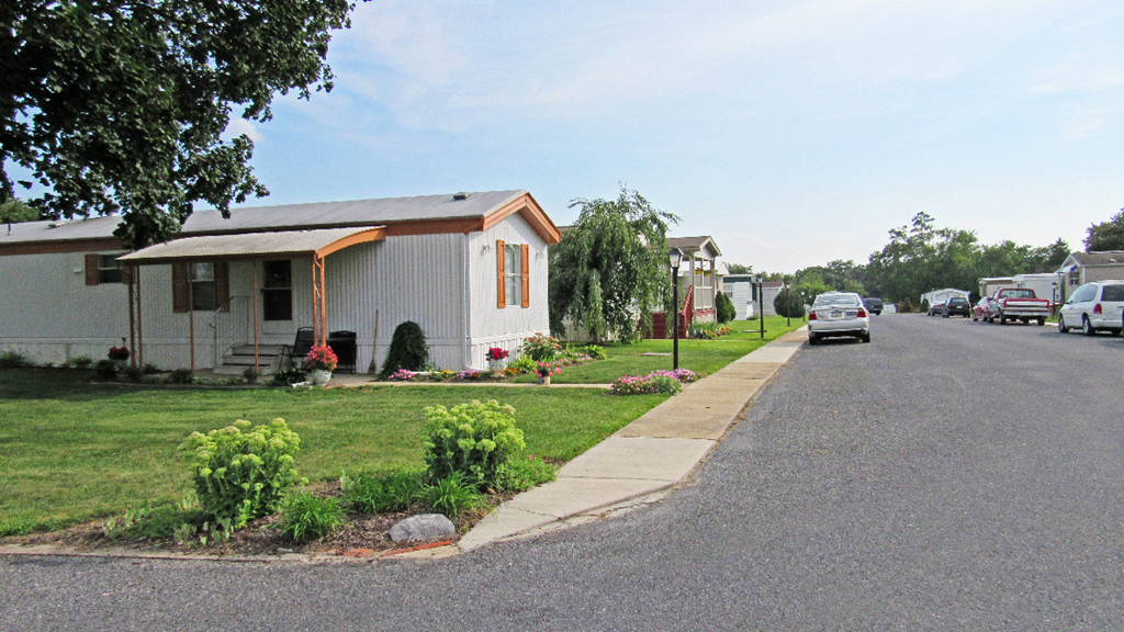 a row of small houses on the side of a street