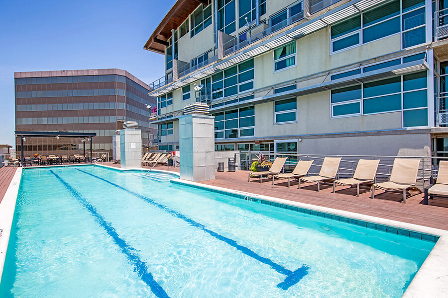 Olympic style swimming pool with sun loungers