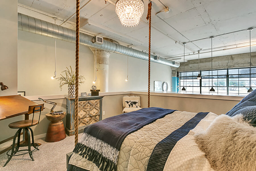 Loft style bedroom with carpet