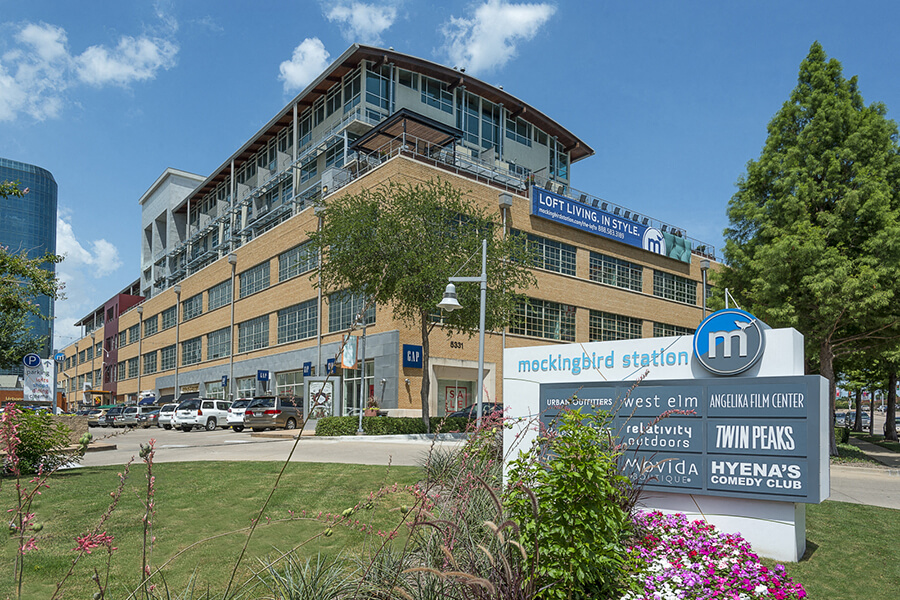 The lofts at mockingbird station is a historical building surrounded by retail and restaurants