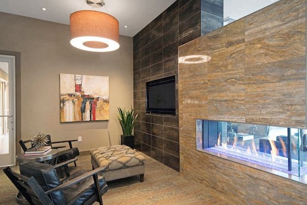 a living room with a tv and a fireplace