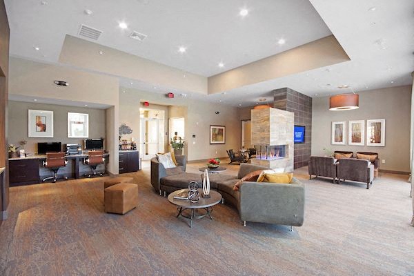 a large living room with couches and a table