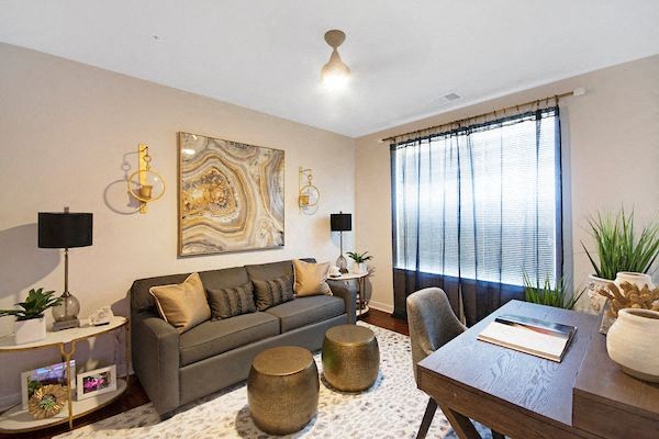 a living room with a couch and a table