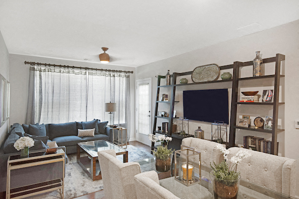 a living room with a couch and a tv