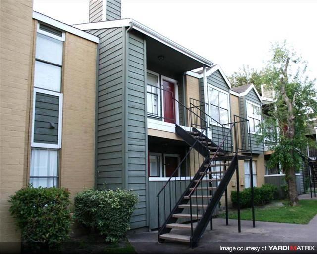 an apartment building with stairs and a