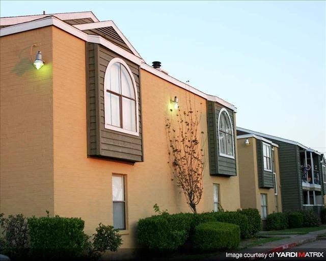 a building with a light on the side of it