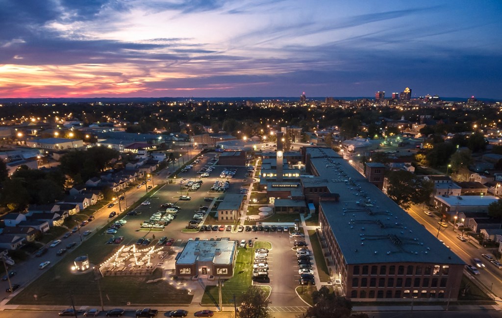 an aerial view of a parking lot in a city at night