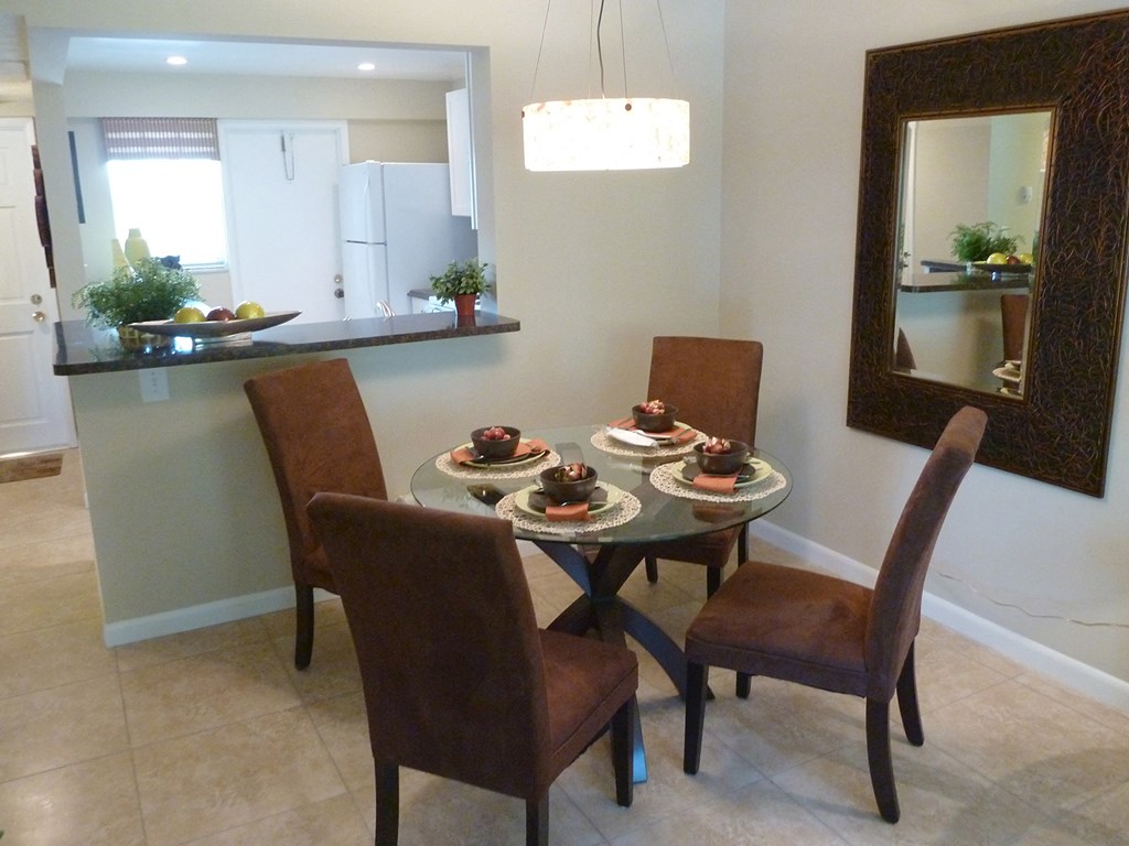 a dining room with a table with plates of food on it