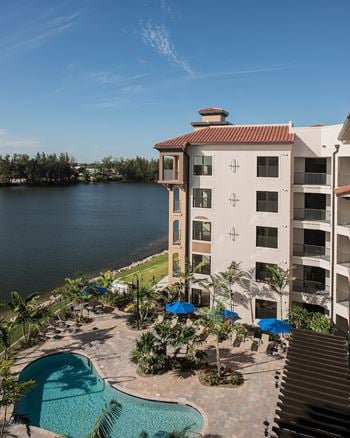 The backyard of the Crystal Riviyera features views of Sailboat Lake, a barbecue area, a pool, and a sun deck.