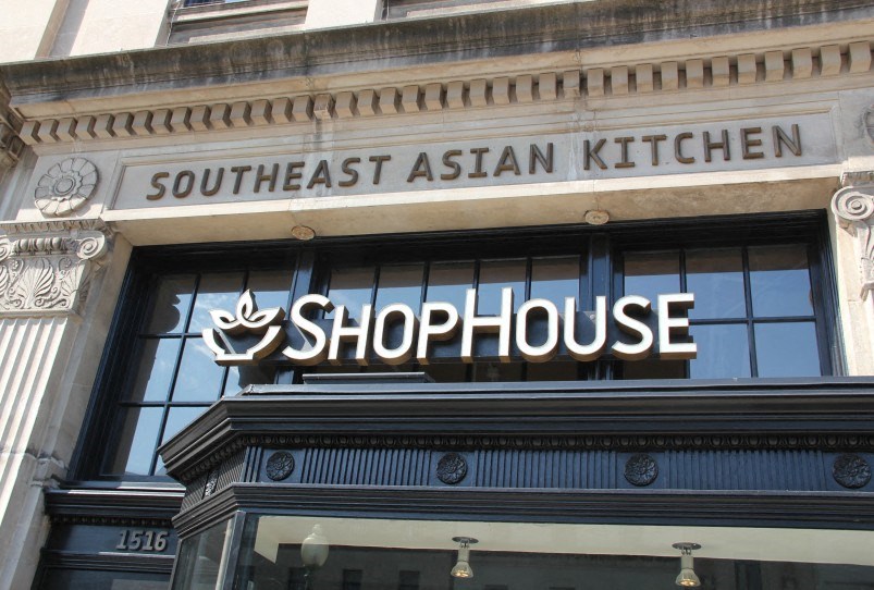 a sign for a restaurant on the front of a building