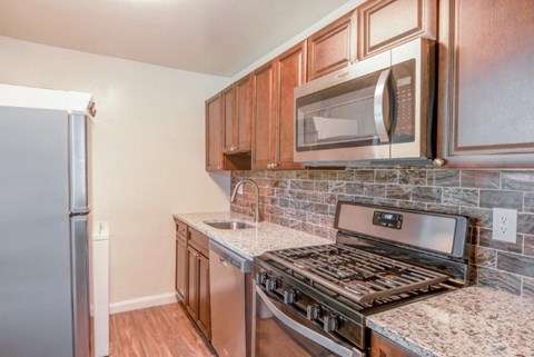 a kitchen with a stove and a microwave