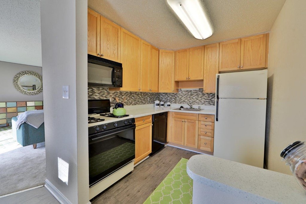 a kitchen with a stove microwave and refrigerator