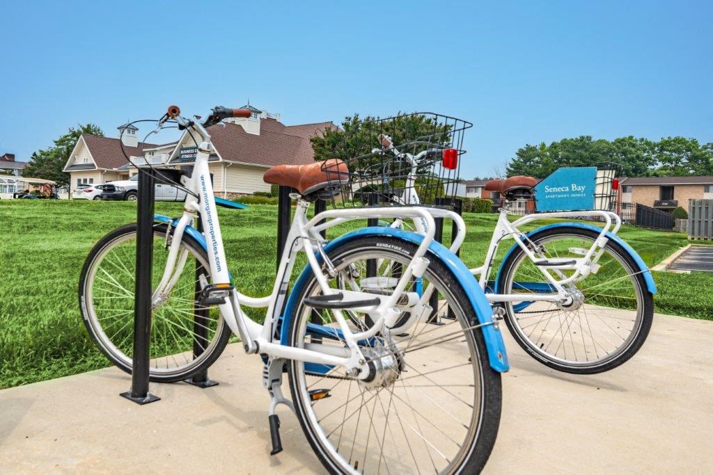 two bikes parked next to each other on a bike rack