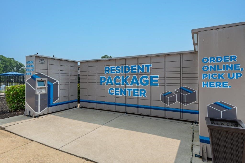 a building with a sign that saysresident package pick up center