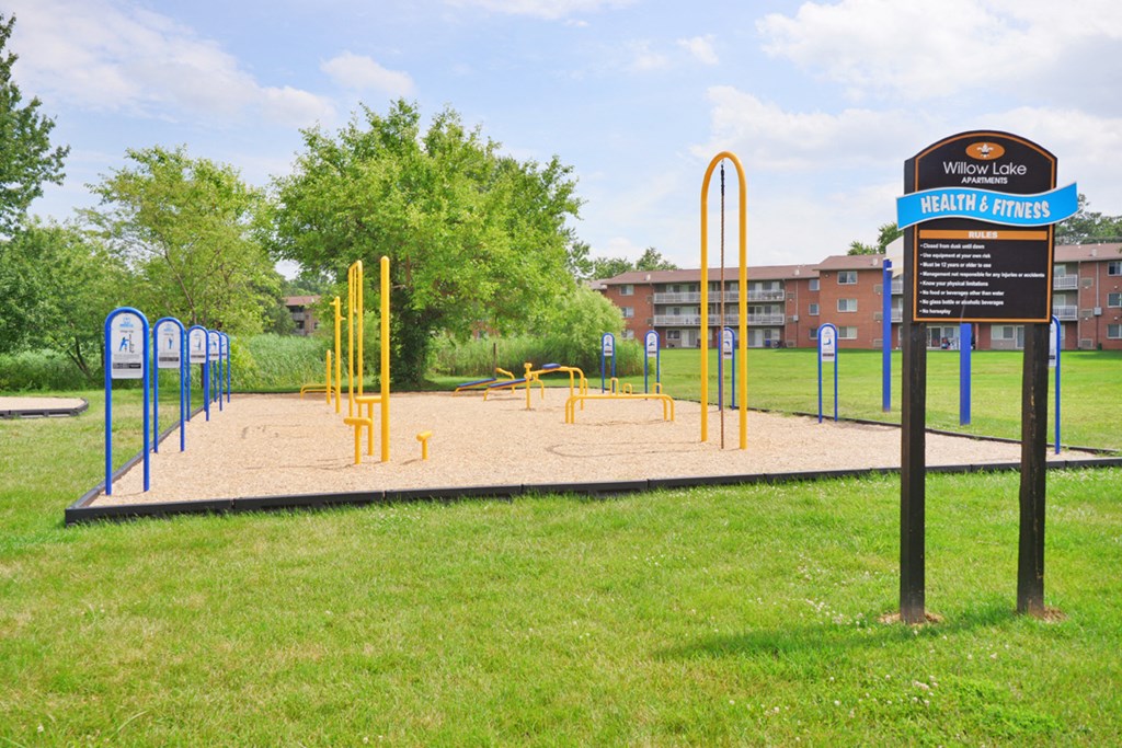 a playground in a park in front of a building