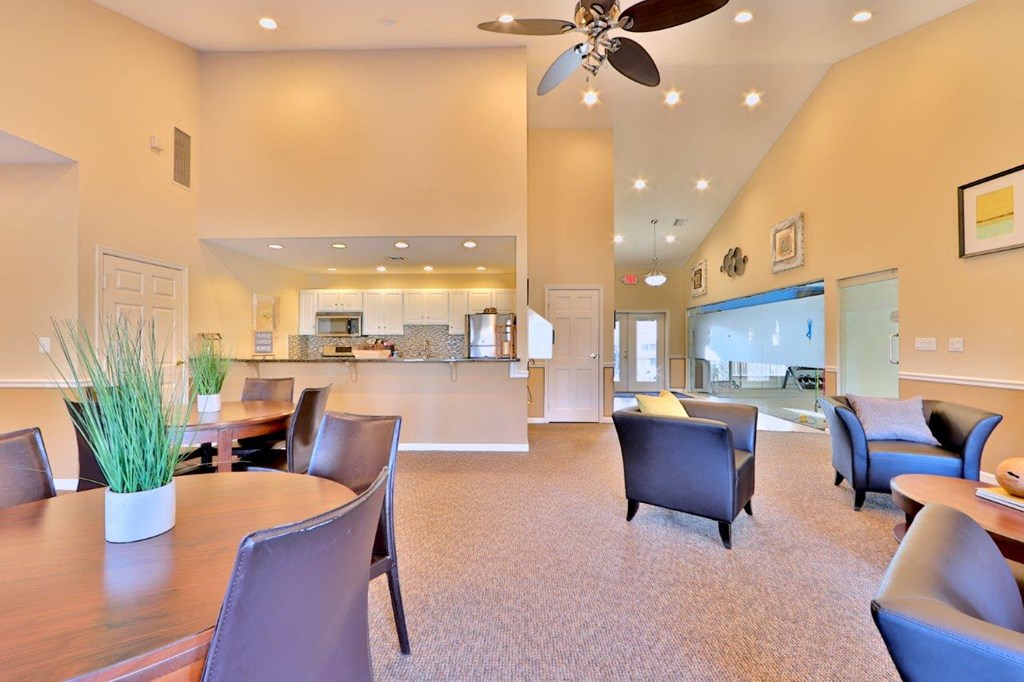 a dining room and living room with a table and chairs
