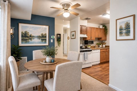 A dining room with a table and chairs is shown.