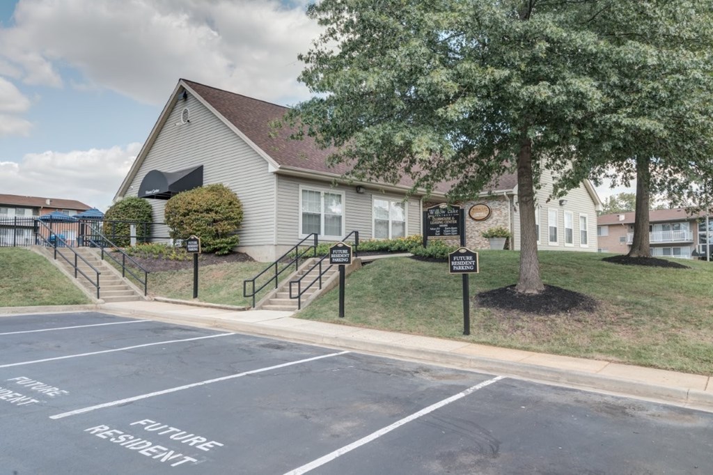 A parking lot with a sign that says "Future Resident" on the ground.