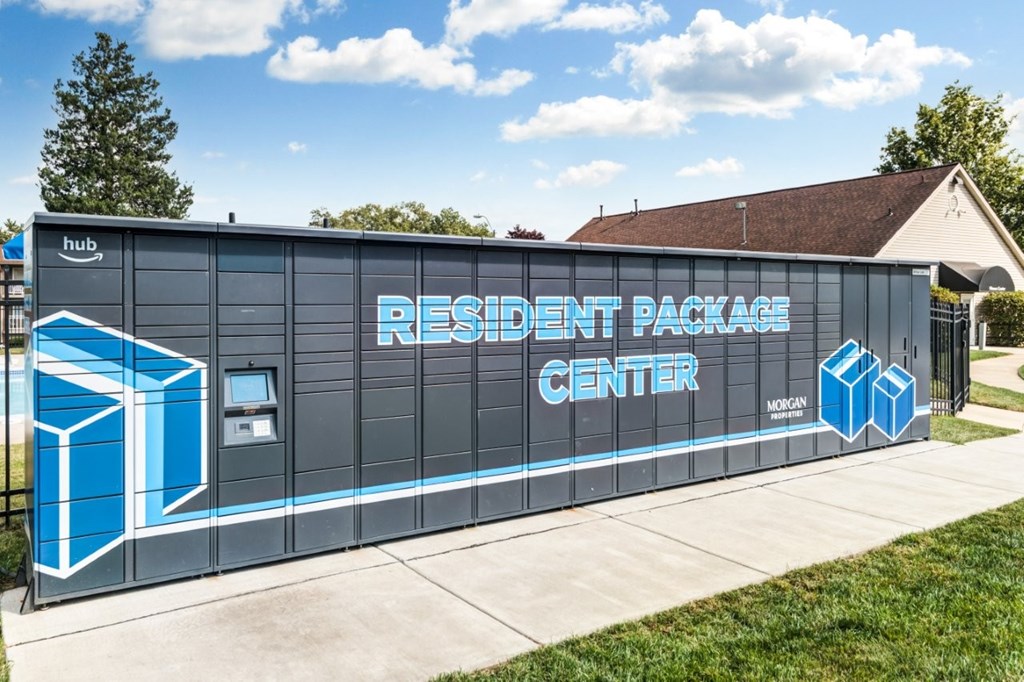 A building with a blue and white sign that says "RESIDENT PACKAGE CENTER".