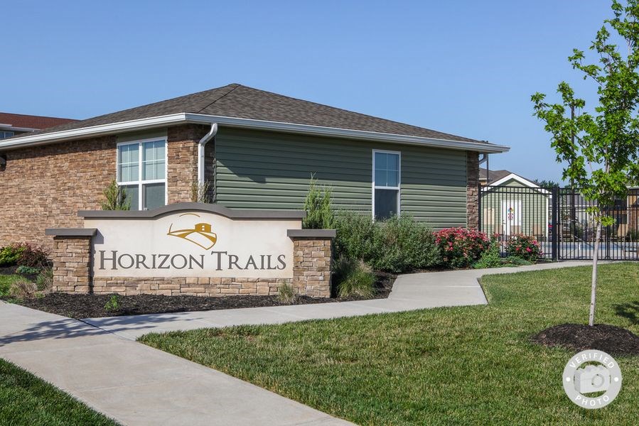 a thornton trails sign in front of a house