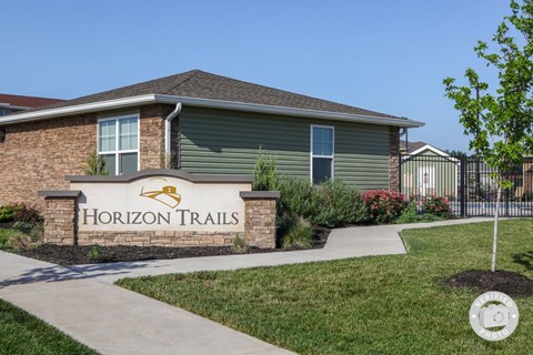 a thornton trails sign in front of a house