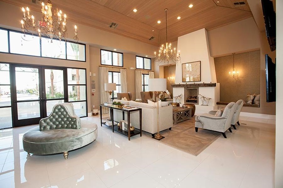 a large living room with couches and chairs