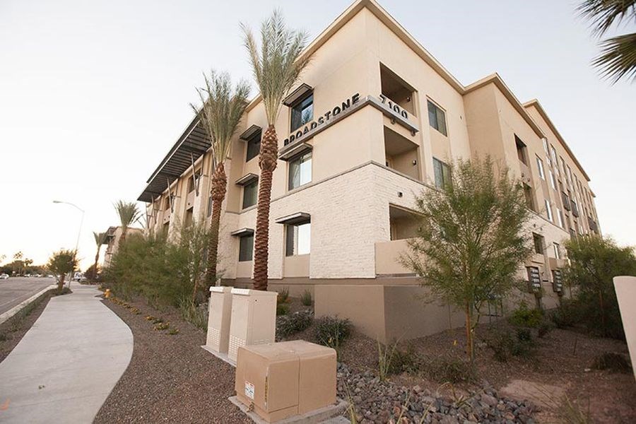 a building with palm trees in front of it