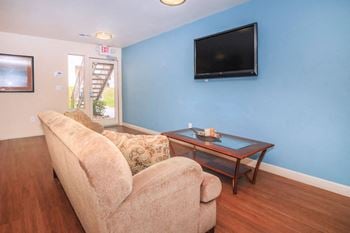 a living room with a couch and a table and a television at Desert Bay Apartments, Laughlin, NV, 89029