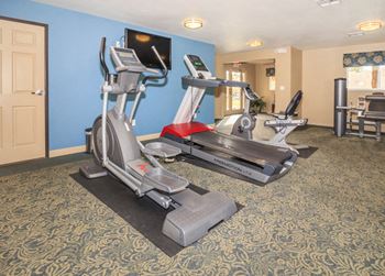 a gym with exercise equipment in a hotel room at Desert Bay Apartments, Laughlin, NV