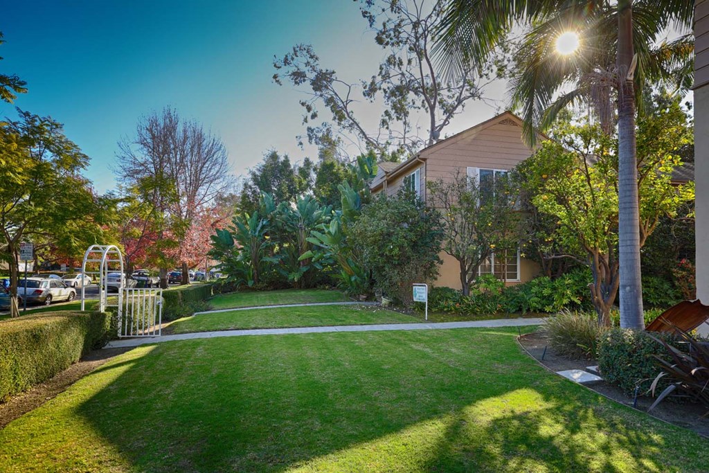 a house with a yard and a sidewalk