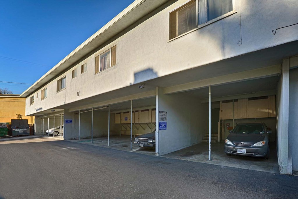 a large building with cars parked outside of it