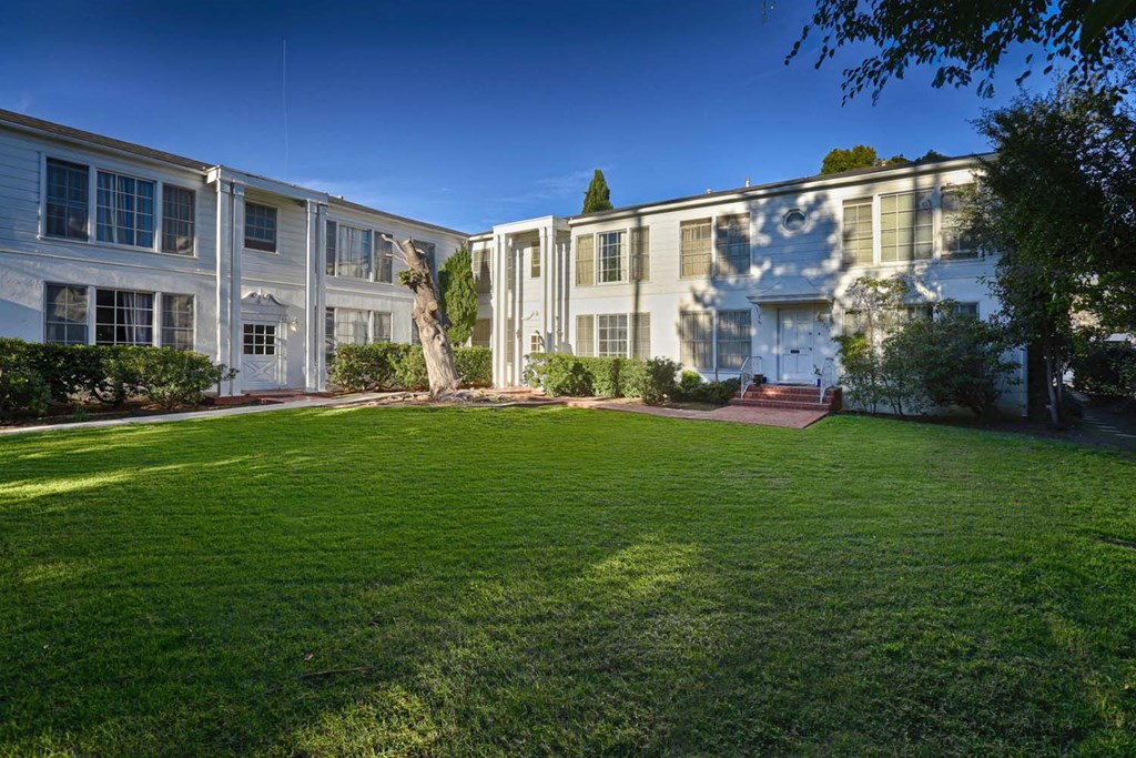 a large lawn in front of a large house