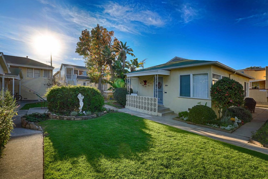 a home with green grass and a yard