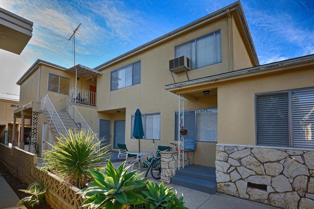 a home with a patio and a bike parked in front of it