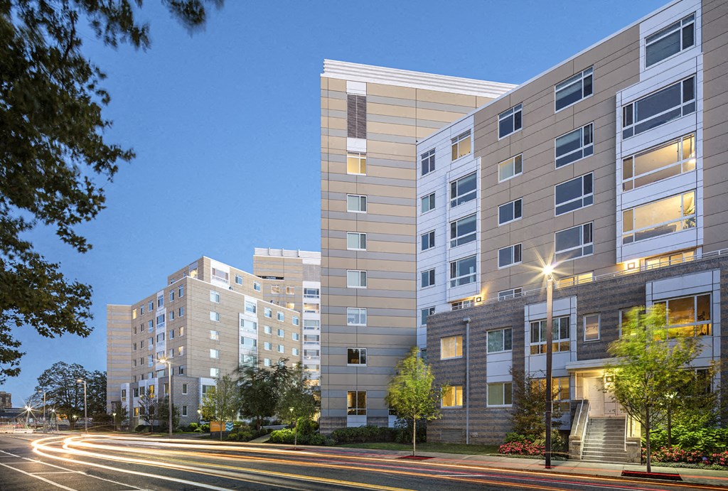 a rendering of an apartment building on a city street