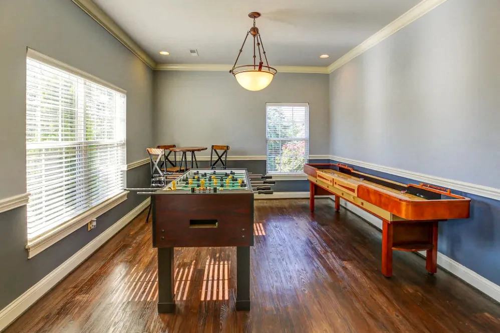 a game room with a pool table and a foosball