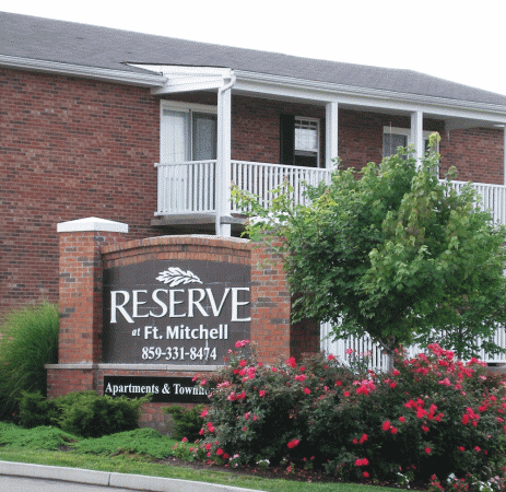 the sign in front of the reserve apartment building