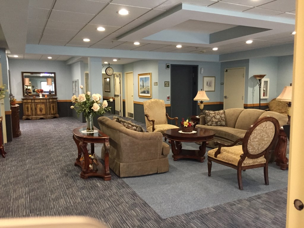 a living room with couches chairs and a table