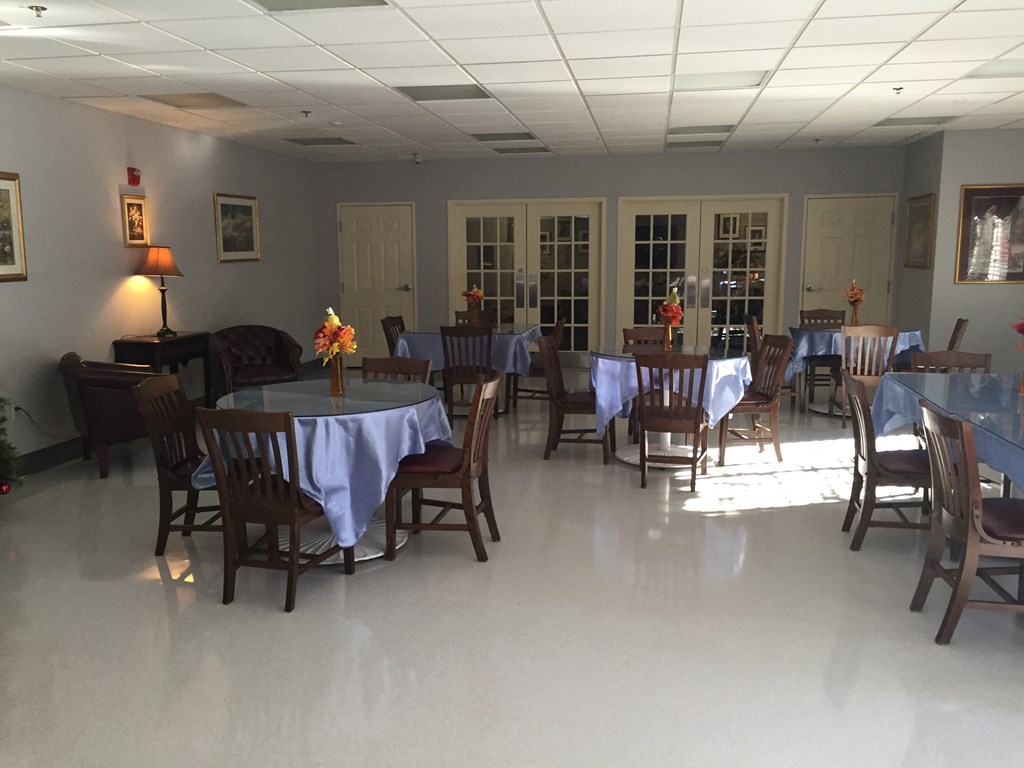a dining room with tables and chairs