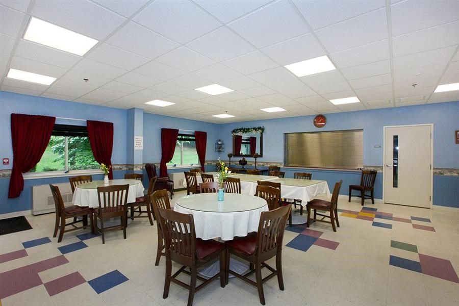 a conference room with tables and chairs in it