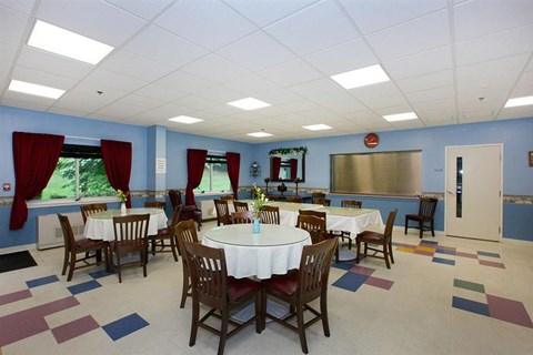 a conference room with tables and chairs in it
