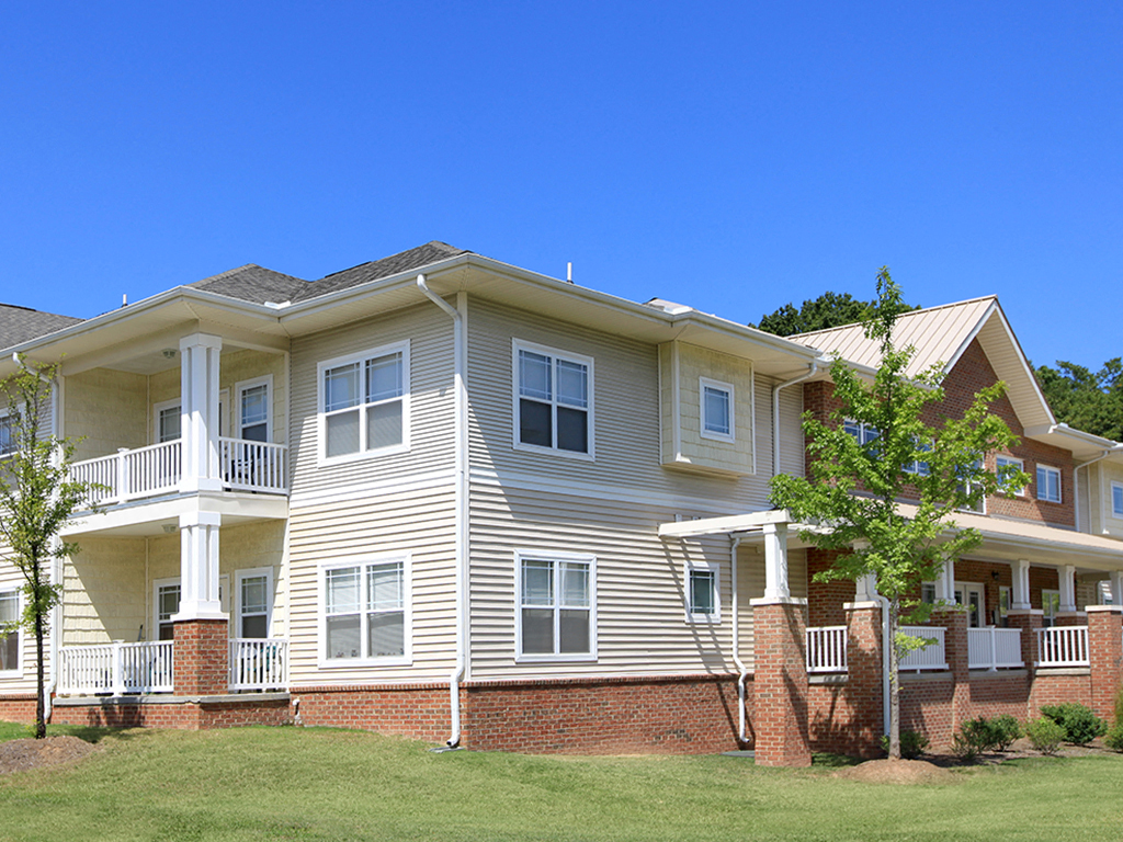 a large house with a yard in front of it